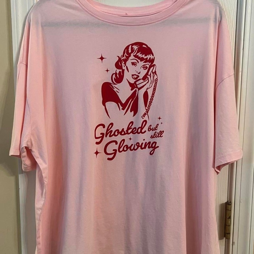 20. Pink graphic cotton t-shirt with red graphic of a woman on a phone, size XXL